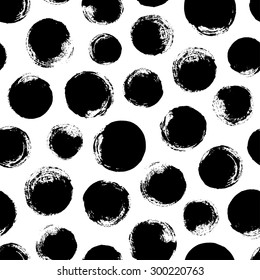 Seamless dot pattern. Hand painted circles with rough edges. Dry brush ink illustration.