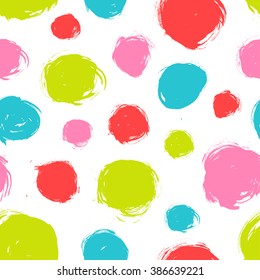 Seamless dot pattern. Hand painted circles with rough edges. Dry brush ink illustration.