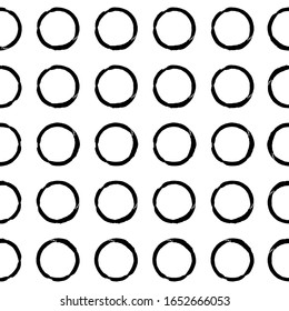 Seamless dot pattern of rings. Vector illustration.