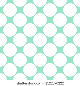 Seamless dotted vector pattern with big white dots on green mint pastel background in flat modern style