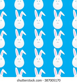 Seamless easter pattern with bunnies in the form of egg on blue background