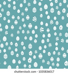 Seamless Easter pattern with eggs on blue background. Vector