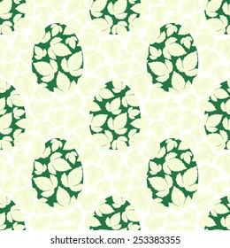 Seamless Easter pattern of leaves overlaid on green eggs on white background.