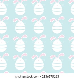 Seamless Easter pattern.Ideal for holiday wrapping paper and postcards. White bunny eggs on a blue background. Cute easter eggs with bunny ears.