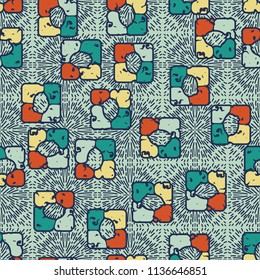 Seamless editable pattern consisting of four varicoloured cobblestones are stacked in the form of a square. On the background dashes of different lengths directed from the center of squares.