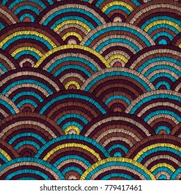 Seamless embroidered pattern. Wavy bohemian print. Patchwork ornament. Yellow, brown and blue colors. Vector illustration.