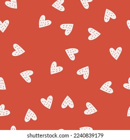 Seamless endless vintage retro pattern with random hearts for printing valentines day products, wrapping paper, fabrics, textile, wallpaper, cards, present, gift boxes on red background