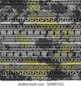 Seamless ethnic background in grunge style. Black and yellow watercolor stains. Handmade. Vector.