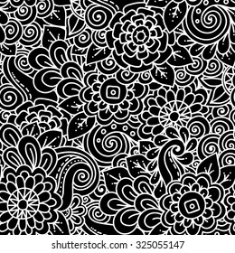Seamless ethnic floral doodle black and white background pattern in vector. Henna paisley mehndi tribal doodles design. Pattern for coloring by kids and adults.