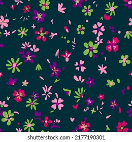 Seamless ethnic floral pattern. Small blossom wildflowers and plants in simple sketch flat manner. Boho style. For fashion design, fabric, textile, wrapping, web, card.