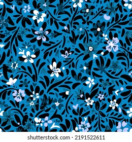 Seamless ethnic floral pattern. Small blossom wildflowers and plants in simple sketch flat manner. Boho style. For fashion design, fabric, textile, wrapping, web, card.