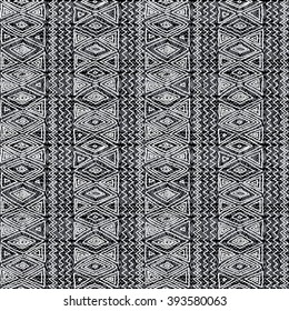 Seamless ethnic geometric pattern. Black and white graphics, diamonds, triangles and zigzags, folk motives, hand drawn background.