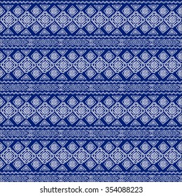 Seamless ethnic geometric pattern. Blue and white graphics, diamonds, triangles and zigzags on a white background, folk motives