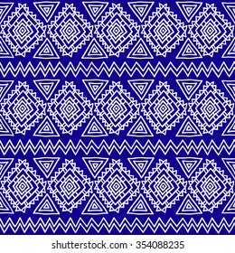Seamless ethnic geometric pattern. Blue and white graphics, diamonds, triangles and zigzags on a white background, folk motives