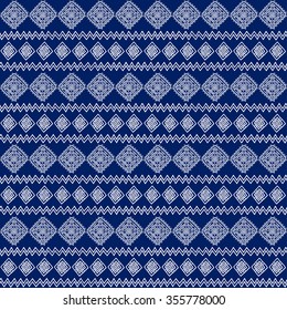 Seamless ethnic geometric pattern. Blue and white graphics, diamonds, triangles and zigzags, folk ethnic motifs.