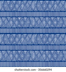 Seamless ethnic geometric pattern. Blue and white graphics, diamonds, triangles and zigzags on a white background, folk ethnic motives.