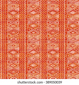 Seamless ethnic geometric pattern. Orange and white graphics, diamonds, triangles and zigzags on a white background, folk motives.