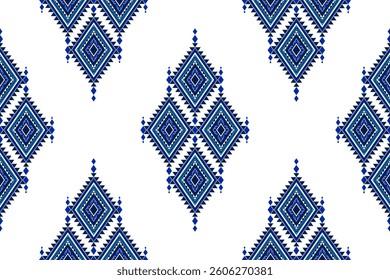 A seamless ethnic geometric textile pattern featuring intricate diamond motifs in navy blue and white. Inspired by traditional designs, perfect for fabric, wallpaper, background, and decorative print.