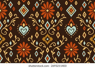 Seamless ethnic ikat floral pattern with geometric diamonds and hearts. Orange, red and gold embroidered texture on dark background. Traditional tribal fabric design for textile, wallpaper.