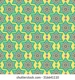 Seamless ethnic oriental star pattern. Colorful folkloric textile design on green background.
