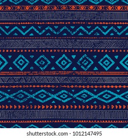 Seamless ethnic ornament. Aztec and tribal motifs. Ornament drawn by hand. Blue and orange colors. Horizontal lines. Print for your textiles. Vector illustration.