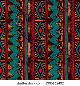 Seamless ethnic ornament. Aztec and tribal motifs. Ornament drawn by hand. Blue, red and orange colors. Vertical lines. Print for your textiles. Vector illustration.