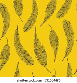 Seamless ethnic pattern with feathers on yellow background. Vector illustration.