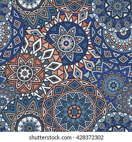 Seamless ethnic pattern with floral motives. Mandala stylized print template for fabric and paper. Boho chic design. Summer fashion.