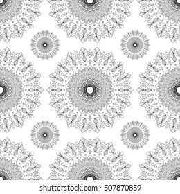 Seamless ethnic pattern with floral motives. Mandala stylized print template for fabric and paper. Outline Mandala for coloring book. Boho chic design. Hand drawn background.