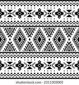 Patrón étnico sin foco. Estilo de la tribu navajo. Motivo nativo americano. Diseño folclórico en formas geométricas. Color blanco y negro. Diseño para textiles, tela, ropa, cortina, alfombra, adorno, fondo.