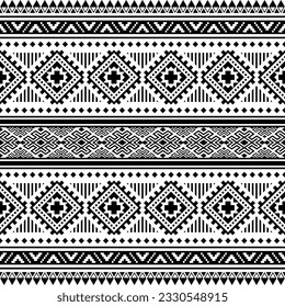 Seamless ethnic pattern. Vector illustration in Navajo and Aztec tribal style. Geometric abstract texture design for fabric print. Black and white colors.