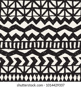 Seamless ethnic and tribal pattern. Hand drawn ornamental stripes. Black and white print for your textiles. Vector geometric background.