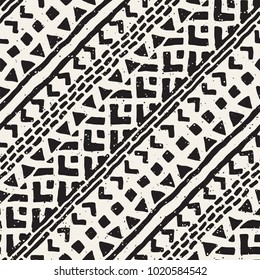 Seamless ethnic and tribal pattern. Hand drawn ornamental stripes. Black and white print for your textiles. Vector geometric background.