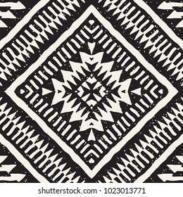 Seamless ethnic and tribal pattern. Hand drawn ornamental stripes. Black and white print for your textiles. Vector geometric background.