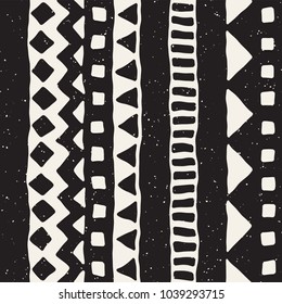 Seamless ethnic and tribal pattern. Hand drawn ornamental stripes. Black and white print for your textiles. Vector background.
