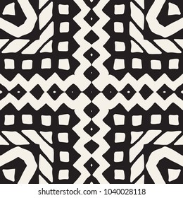 Seamless ethnic and tribal pattern. Hand drawn ornamental stripes. Black and white print for your textiles. Vector background.