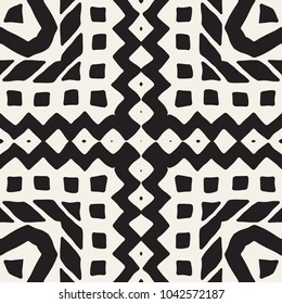 Seamless ethnic and tribal pattern. Hand drawn ornamental stripes. Black and white print for your textiles. Vector geometric background.