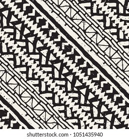 Seamless ethnic and tribal pattern. Hand drawn ornamental stripes. Black and white print for your textiles. Vector geometric background.