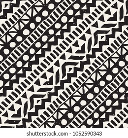 Seamless ethnic and tribal pattern. Hand drawn ornamental stripes. Black and white print for your textiles. Vector geometric background.