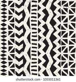 Seamless ethnic and tribal pattern. Hand drawn ornamental stripes. Black and white print for your textiles. Vector geometric background.