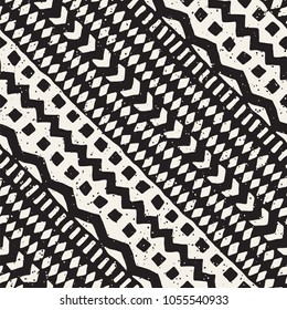 Seamless ethnic and tribal pattern. Hand drawn ornamental stripes. Black and white print for your textiles. Vector geometric background.