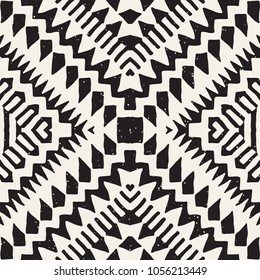 Seamless ethnic and tribal pattern. Hand drawn ornamental stripes. Black and white print for your textiles. Vector geometric background.