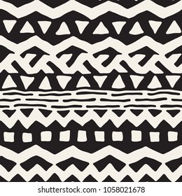 Seamless ethnic and tribal pattern. Hand drawn ornamental stripes. Black and white print for your textiles. Vector geometric background.