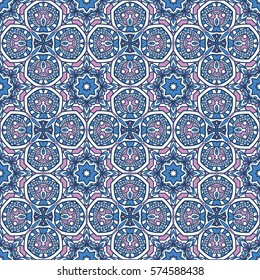 Seamless ethnic vector background with floral and geometric ornament. Luxury embellished pattern executed in oriental style.