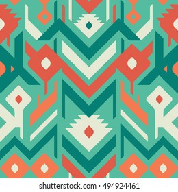 Seamless Ethnic Vector Pattern for Textile Design. Mix of Triangles, Stripes and Rhombuses. Green and Red Shapes