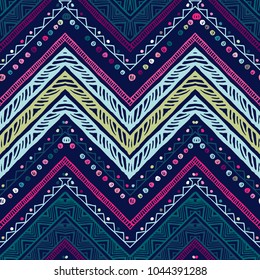 Seamless ethnic zigzag chevron pattern. Hand drawn colorful geometric background. Striped tribal motifs. Vector illustration