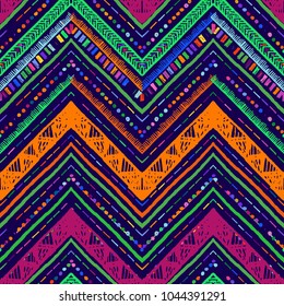 Seamless ethnic zigzag chevron pattern. Hand drawn colorful geometric background. Striped tribal motifs. Vector illustration