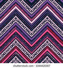 Seamless ethnic zigzag chevron pattern. Hand drawn colorful geometric background. Striped tribal motifs. Vector illustration