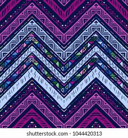Seamless ethnic zigzag chevron pattern. Hand drawn colorful geometric background. Striped tribal motifs. Vector illustration