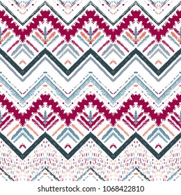 Seamless ethnic zigzag chevron pattern. Hand drawn colorful geometric background. Striped tribal motifs. Vector illustration